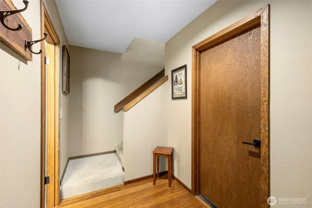 a view of front door and wooden floor