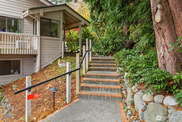 a view of a house with swimming pool and garden