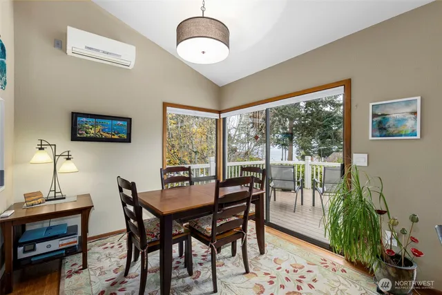 a view of a dining room with furniture window and outside view