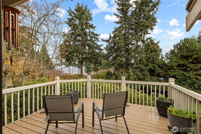 a view of a chair and table on the deck