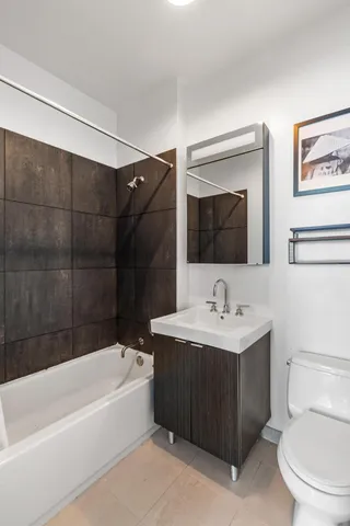 a bedroom with a bed and a lamp