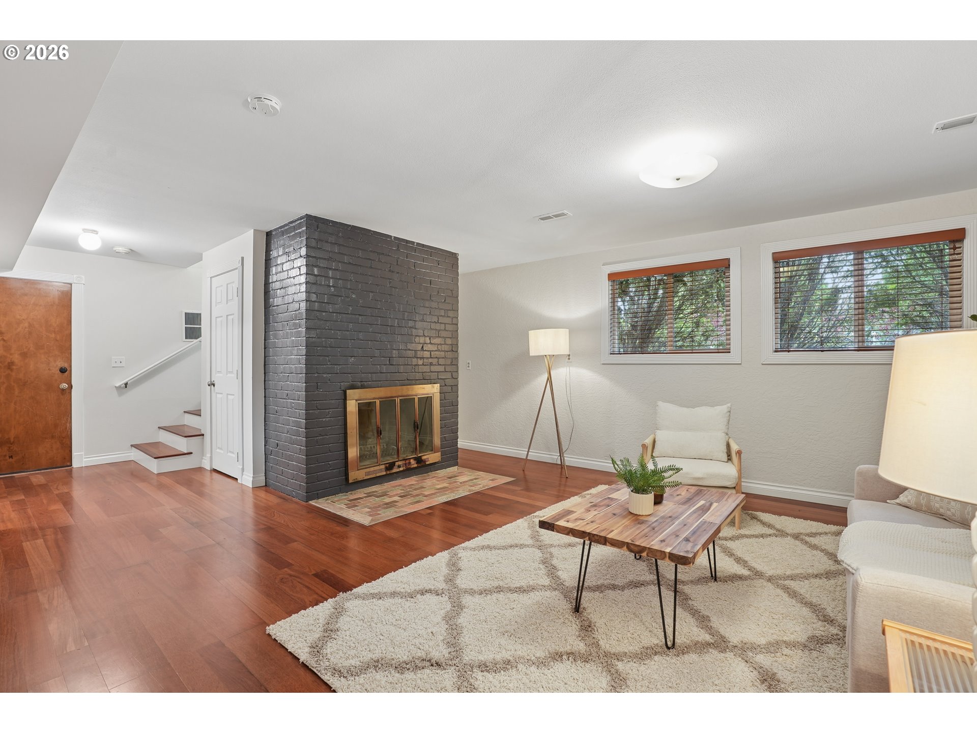 992 South South End Road Oregon City, OR 97045 - Photo 27 of 38 a living room with furniture and a fireplace
