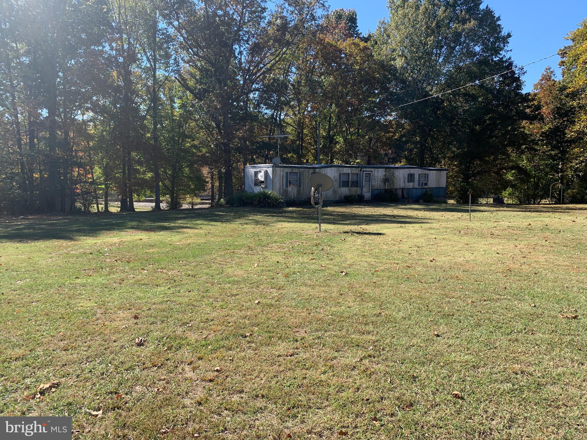28282 Raccoon Ford Road Culpeper, VA 22701 - Photo 23 of 34 a view of a swimming pool with an outdoor space and seating area