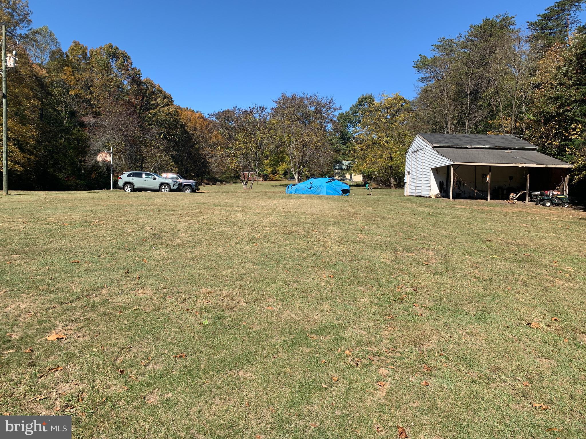 28282 Raccoon Ford Road Culpeper, VA 22701 - Photo 24 of 34 a tall yellow house with a yard