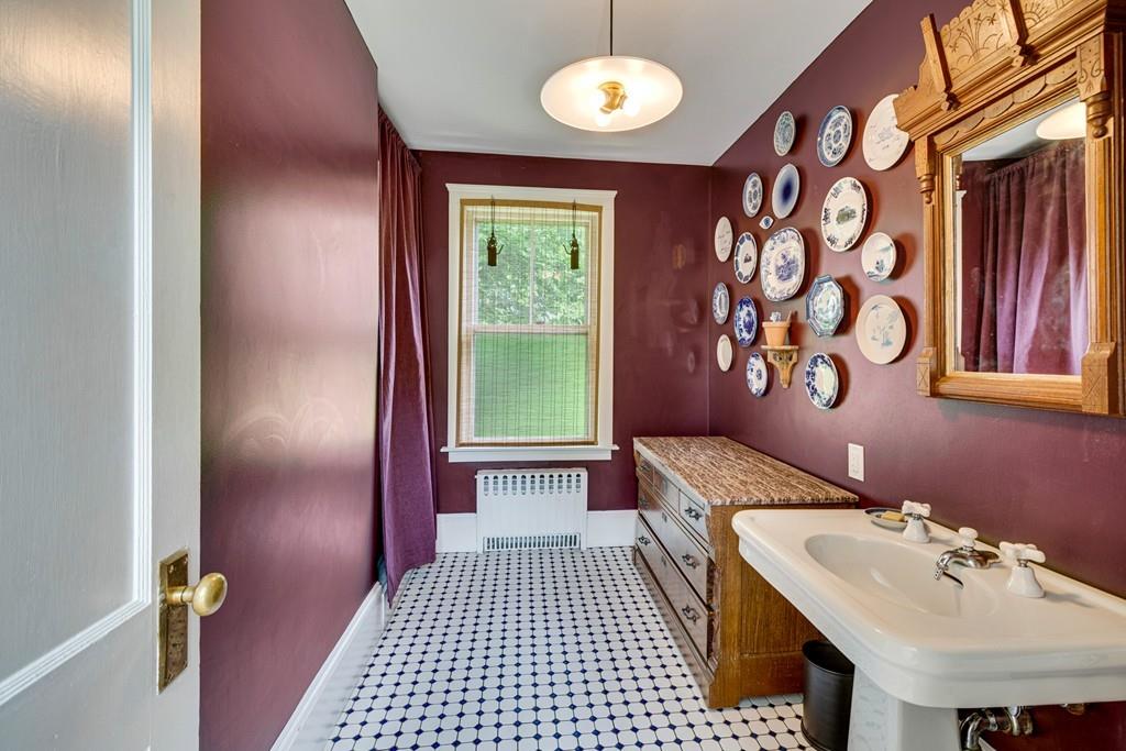 208 Ridge Street Winchester, MA 01890 - Photo 18 of 42 a bathroom with a sink and a mirror