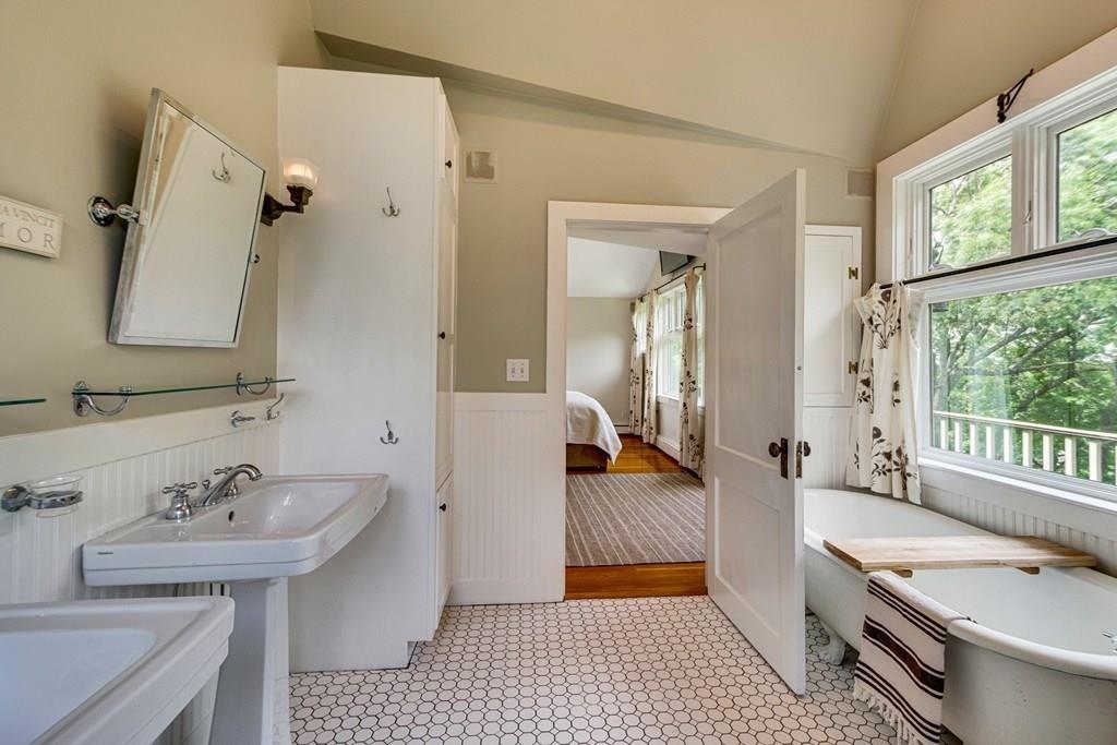 208 Ridge Street Winchester, MA 01890 - Photo 25 of 42 a bathroom with a sink and a mirror