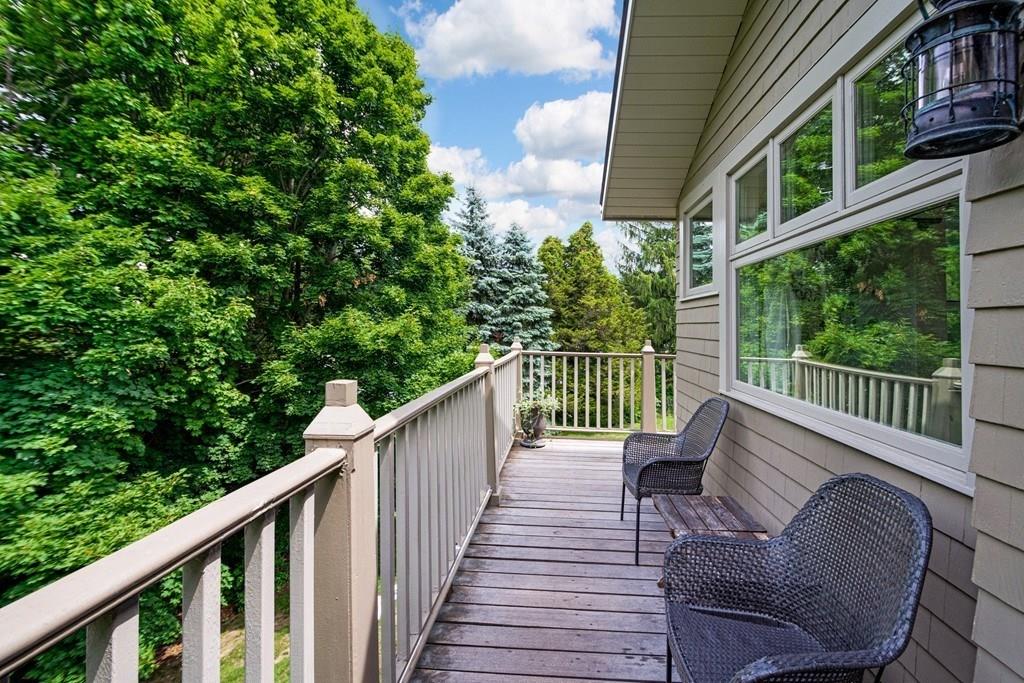 208 Ridge Street Winchester, MA 01890 - Photo 26 of 42 a balcony with wooden floor and outdoor seating