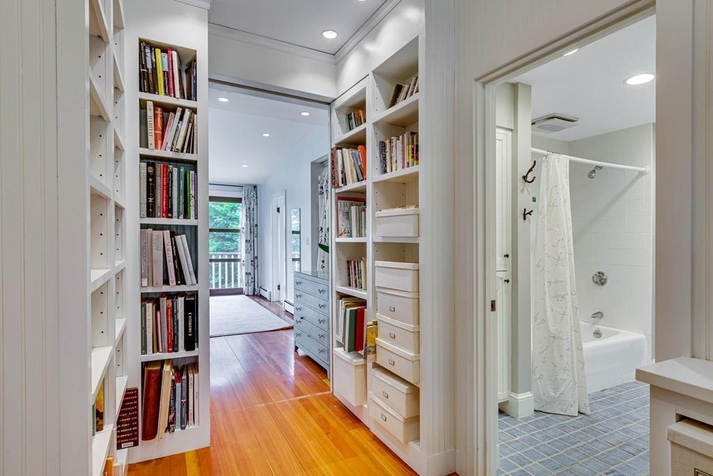 208 Ridge Street Winchester, MA 01890 - Photo 29 of 42 a view of walk in closet with clothes and shoes