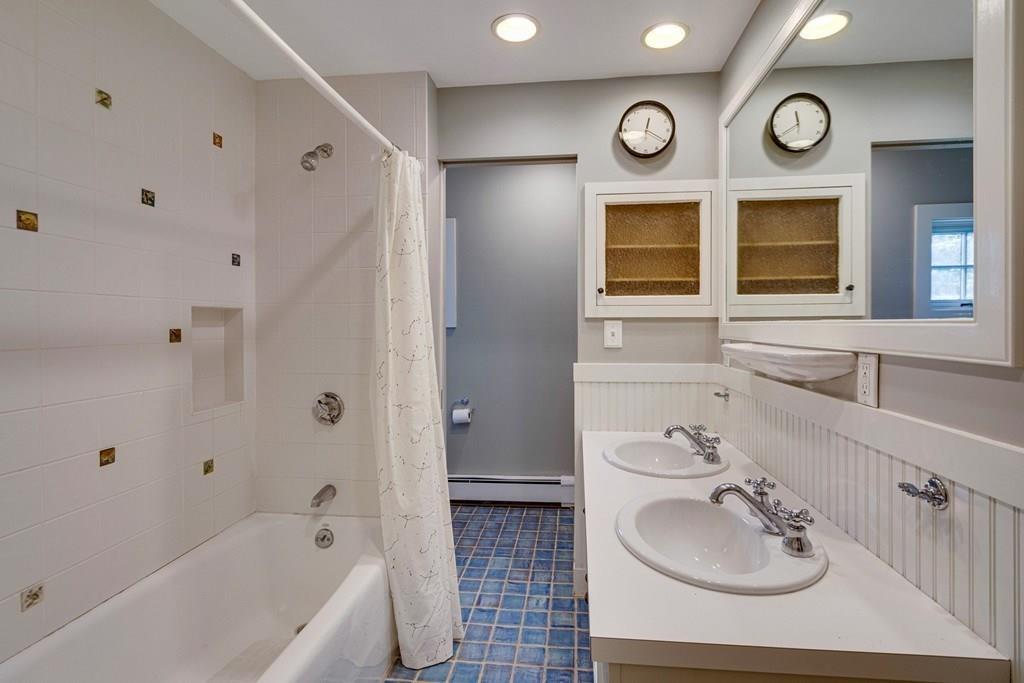 208 Ridge Street Winchester, MA 01890 - Photo 30 of 42 a bathroom with a sink and a bathtub