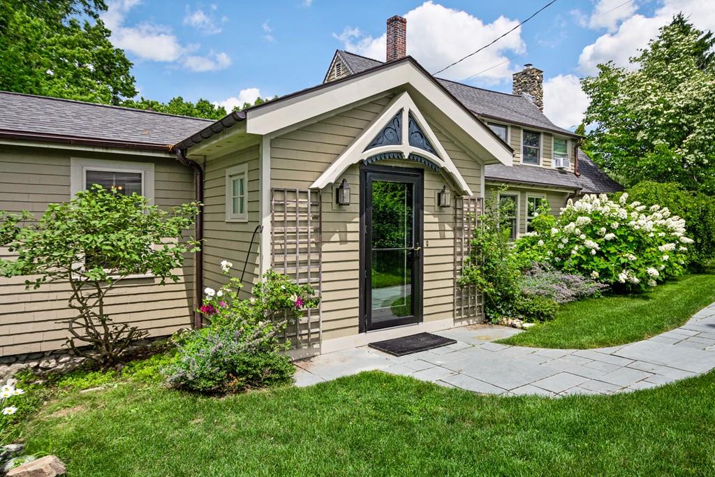 208 Ridge Street Winchester, MA 01890 - Photo 3 of 42 a front view of a house with a yard