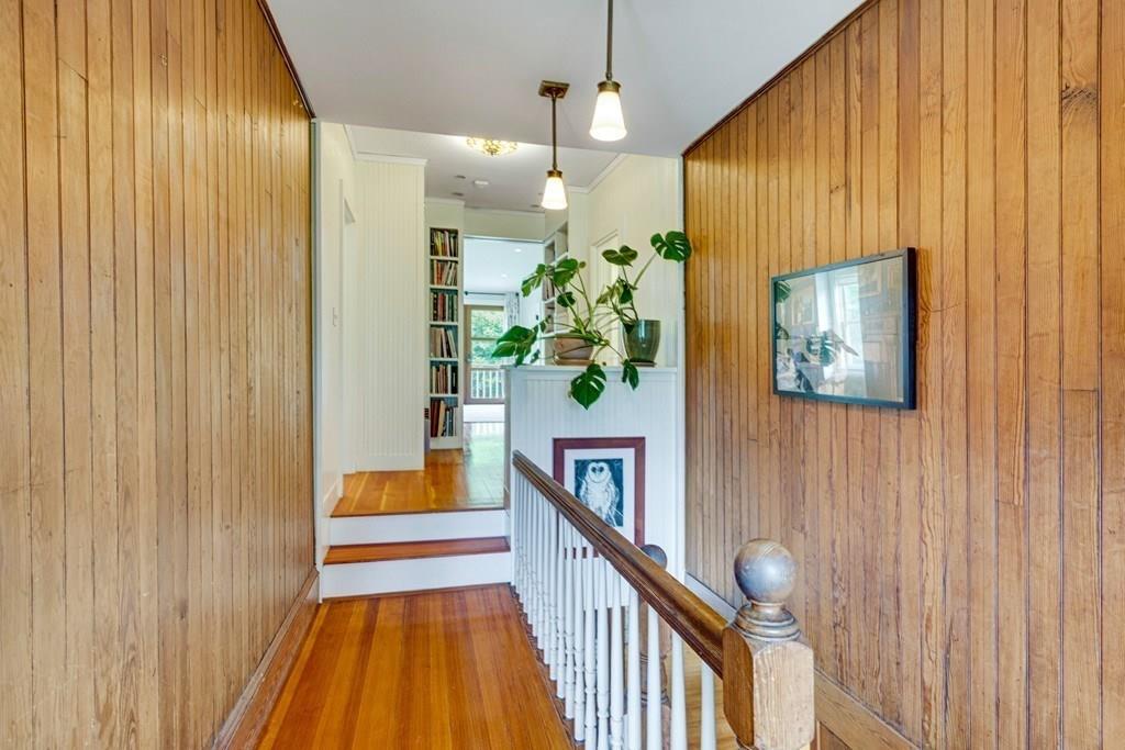 208 Ridge Street Winchester, MA 01890 - Photo 31 of 42 a view of a hallway with wooden floor and staircase