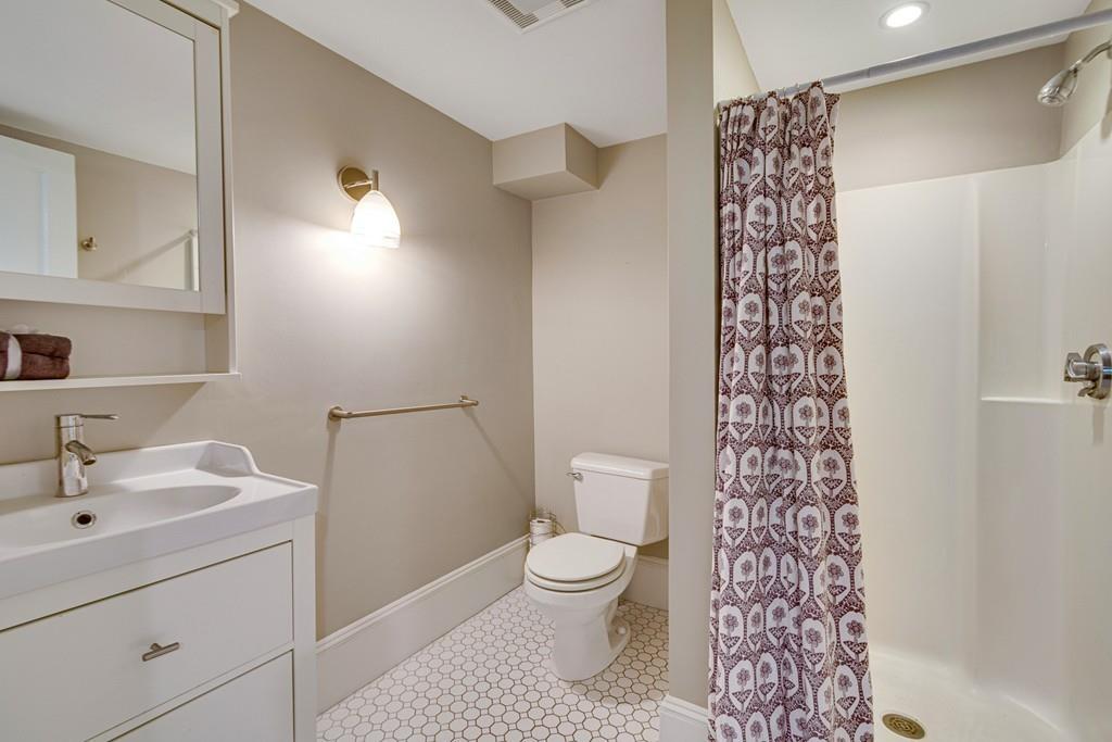 208 Ridge Street Winchester, MA 01890 - Photo 35 of 42 a bathroom with a sink toilet and shower