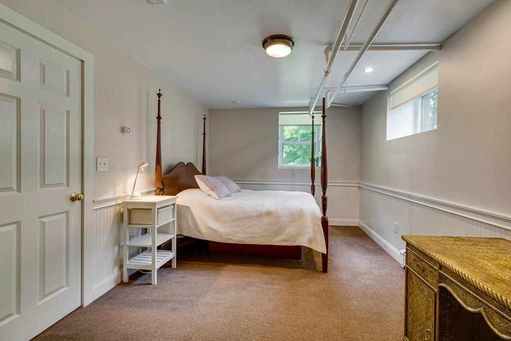 208 Ridge Street Winchester, MA 01890 - Photo 36 of 42 a bedroom with a bed and a ceiling fan