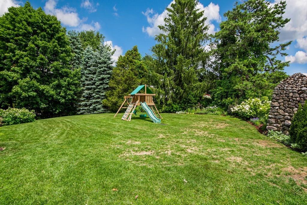 208 Ridge Street Winchester, MA 01890 - Photo 38 of 42 a view of a garden with a slide