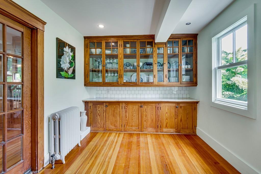 208 Ridge Street Winchester, MA 01890 - Photo 7 of 42 a view of an empty room with a window and wooden floor