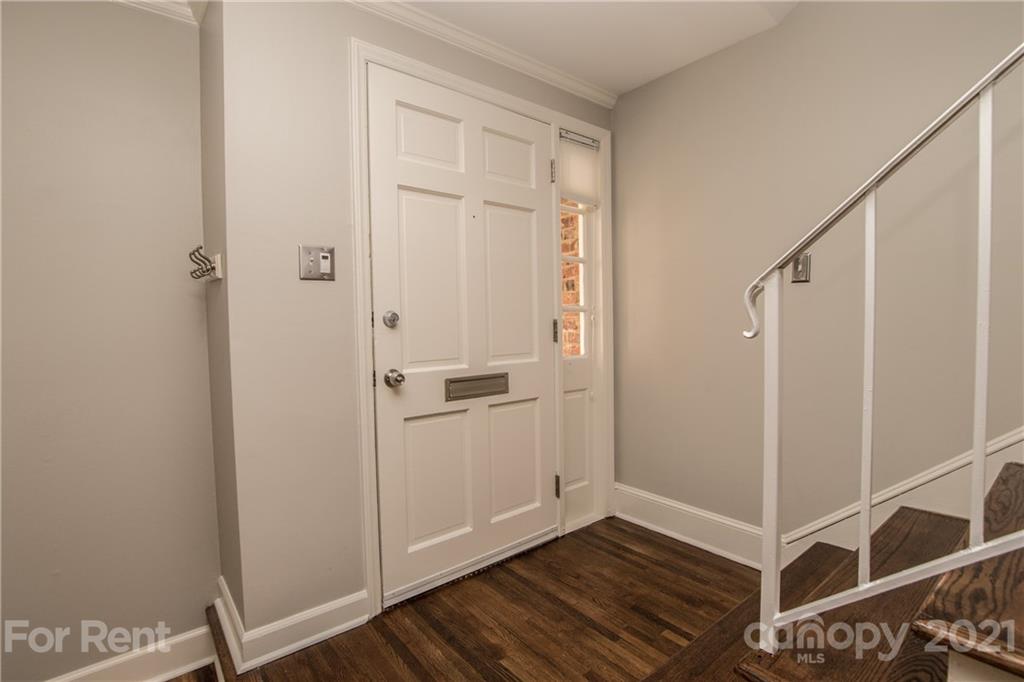 852 McAlway Road Charlotte, NC 28211 - Photo 2 of 26 a view of a hallway with wooden floor and entryway