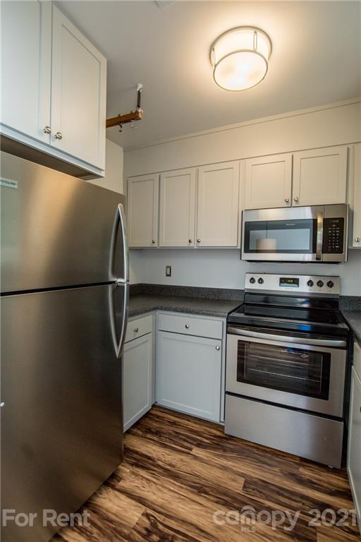 852 McAlway Road Charlotte, NC 28211 - Photo 11 of 26 a kitchen with stainless steel appliances granite countertop a refrigerator and a stove top oven