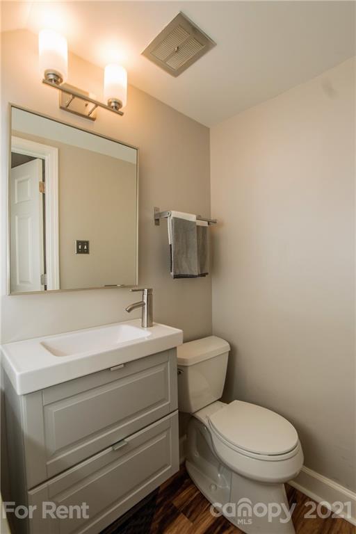 852 McAlway Road Charlotte, NC 28211 - Photo 14 of 26 a bathroom with a toilet sink and mirror