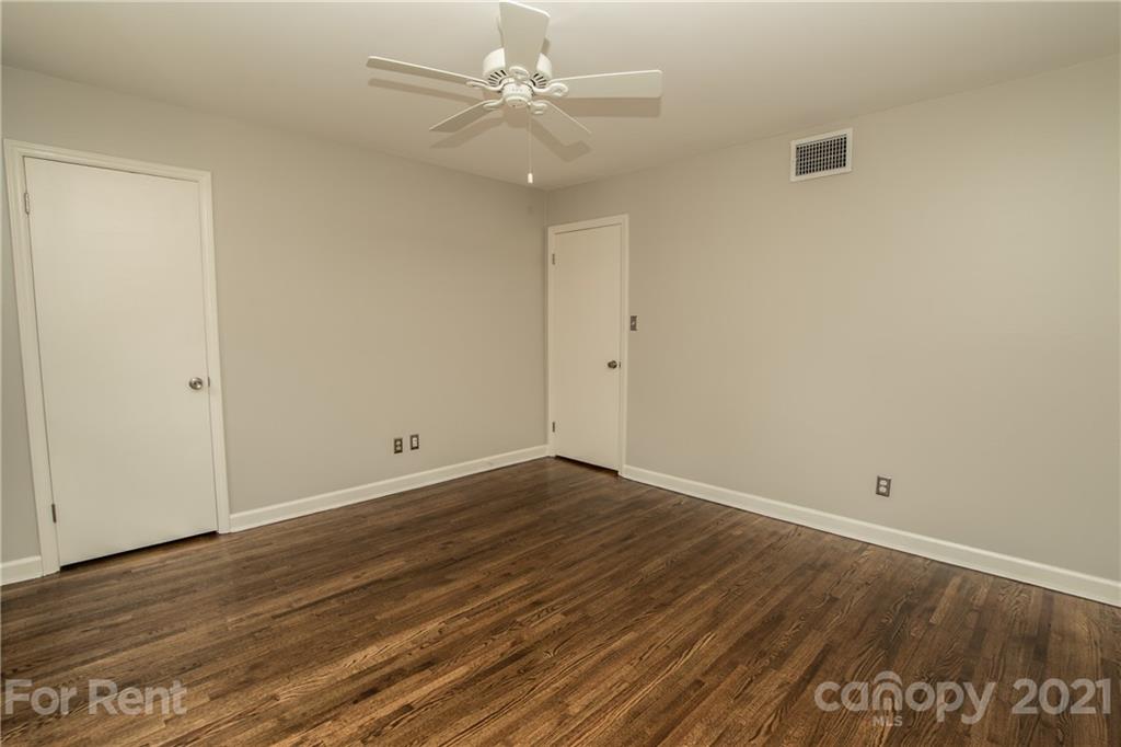 852 McAlway Road Charlotte, NC 28211 - Photo 17 of 26 a view of an empty room with wooden floor