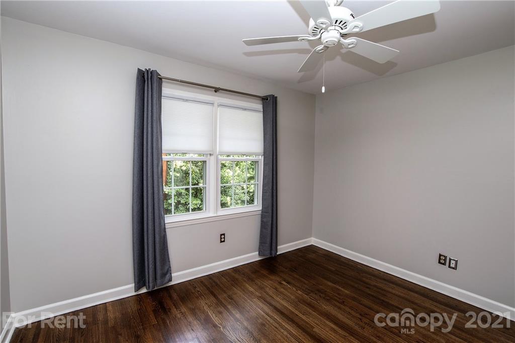 852 McAlway Road Charlotte, NC 28211 - Photo 19 of 26 wooden floor in an empty room with a window