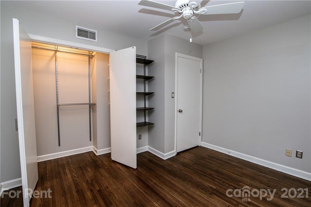 852 McAlway Road Charlotte, NC 28211 - Photo 21 of 26 wooden floor in an empty room with a window