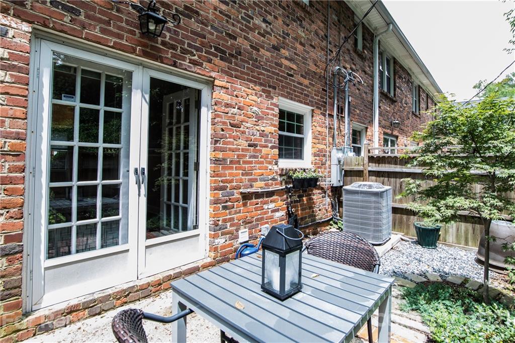 852 McAlway Road Charlotte, NC 28211 - Photo 24 of 26 a backyard of a house with table and chairs
