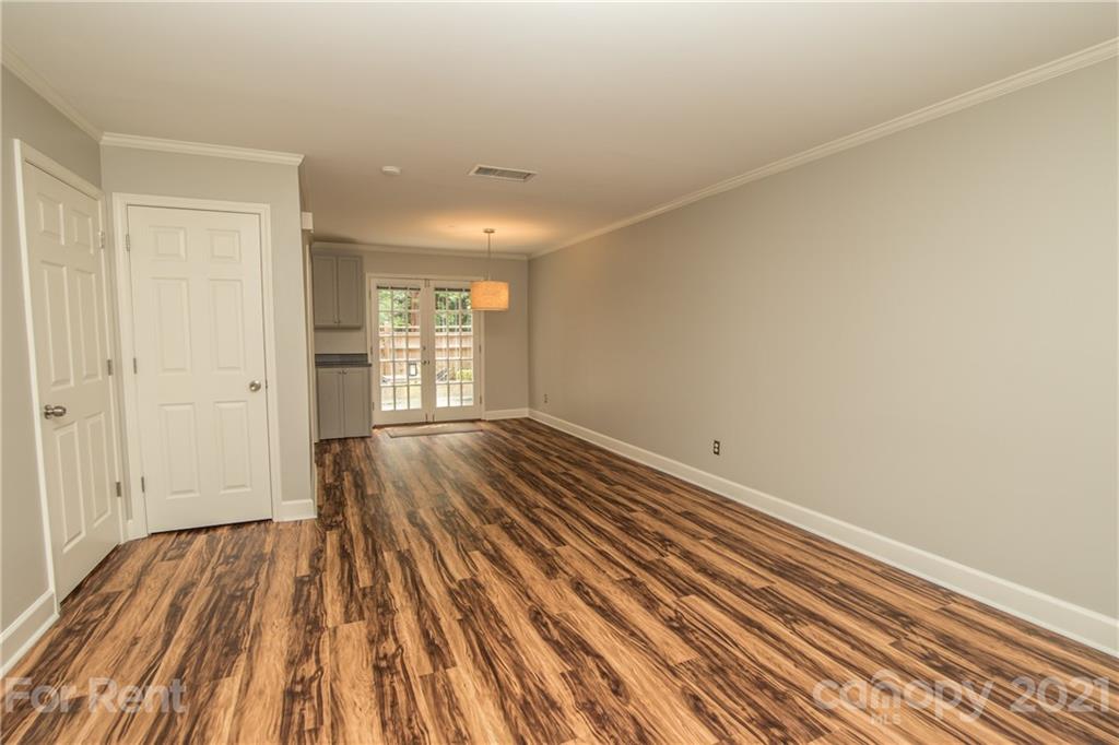852 McAlway Road Charlotte, NC 28211 - Photo 5 of 26 wooden floor in an empty room with a window