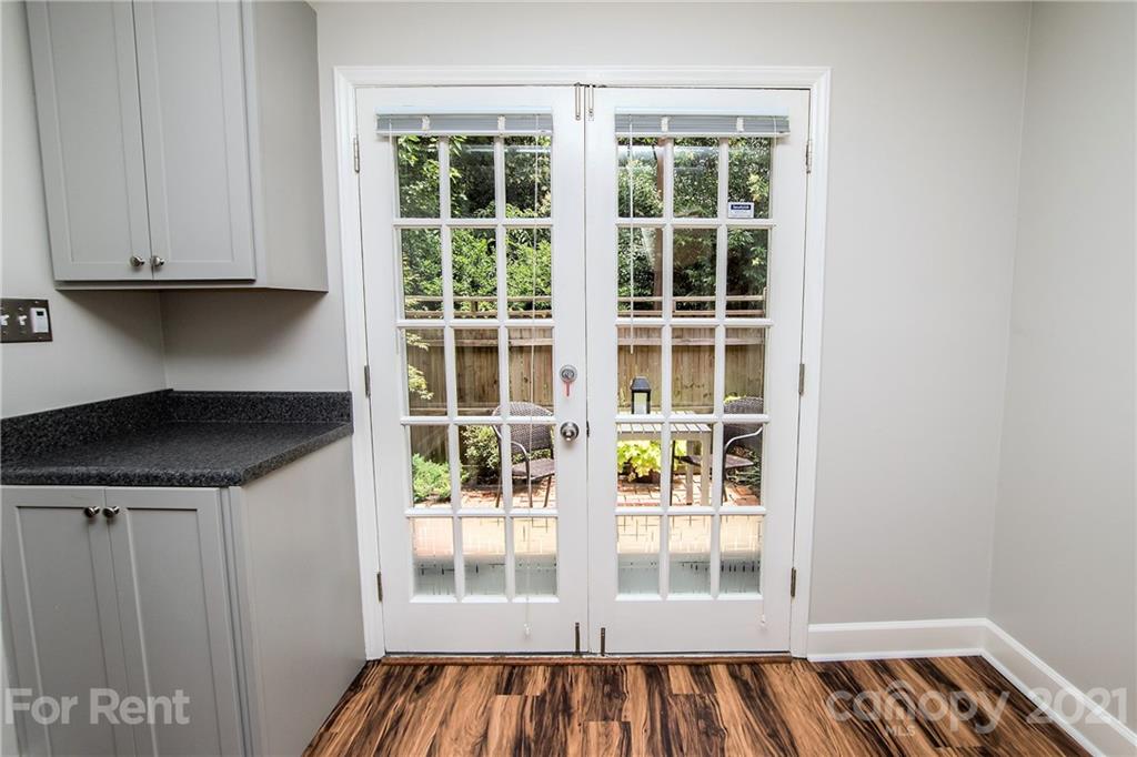 852 McAlway Road Charlotte, NC 28211 - Photo 7 of 26 a view of a room with wooden floor and windows
