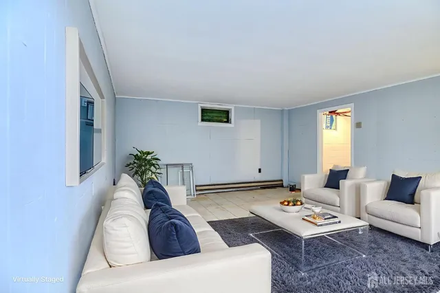 a living room with furniture and window