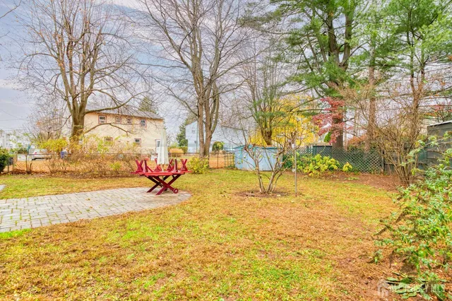a view of a playground with basketball court