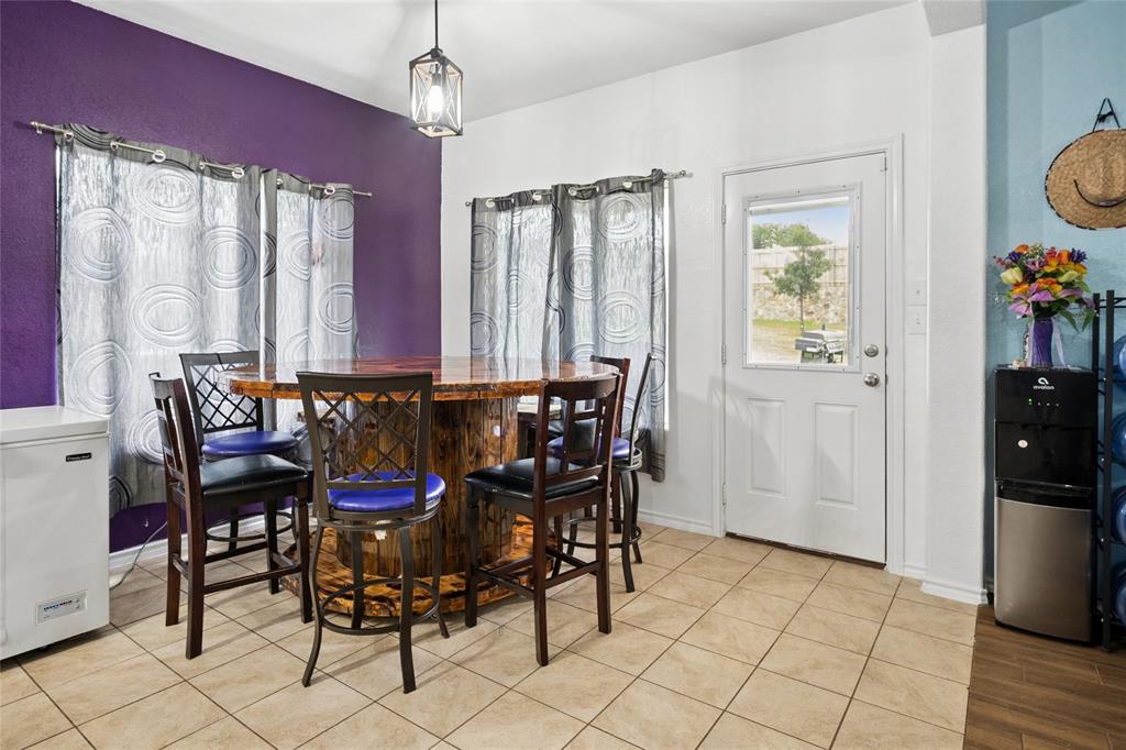 324 Fairgrounds Lane Ponder, TX 76259 - Photo 12 of 40 a view of a dining room with furniture and window