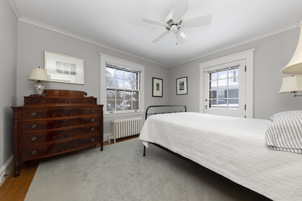 39 Somerset Road Lexington, MA 02420 - Photo 13 of 20 a bedroom with a bed dresser and a window