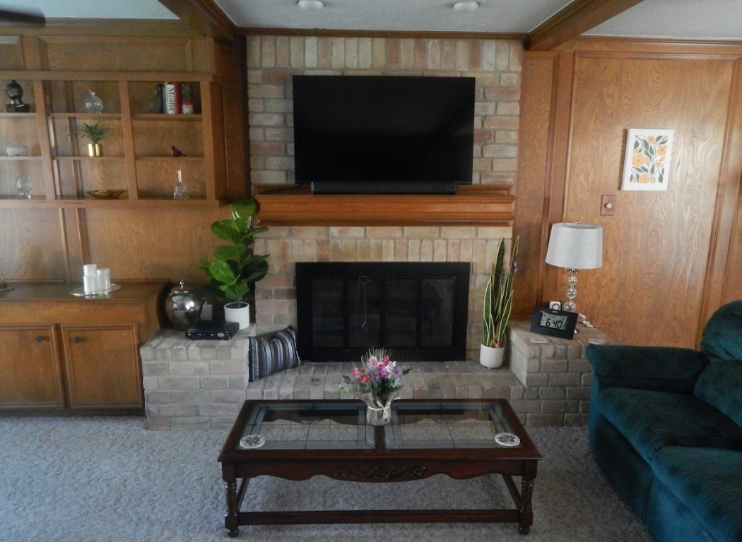 5219 Glenmere Lane Spring, TX 77379 - Photo 15 of 36 a living room with furniture and a fireplace