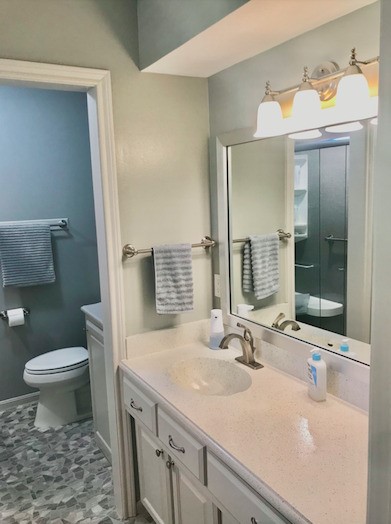 5219 Glenmere Lane Spring, TX 77379 - Photo 19 of 36 a bathroom with a sink and a mirror