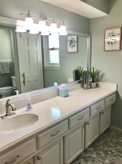 5219 Glenmere Lane Spring, TX 77379 - Photo 24 of 36 a bathroom with a sink and a mirror