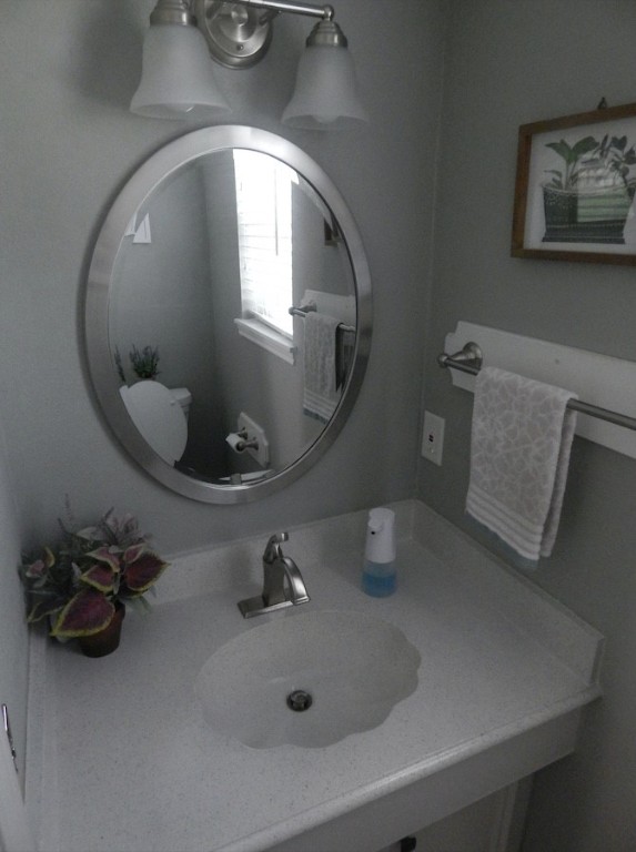 5219 Glenmere Lane Spring, TX 77379 - Photo 32 of 36 a bathroom with a sink and a mirror