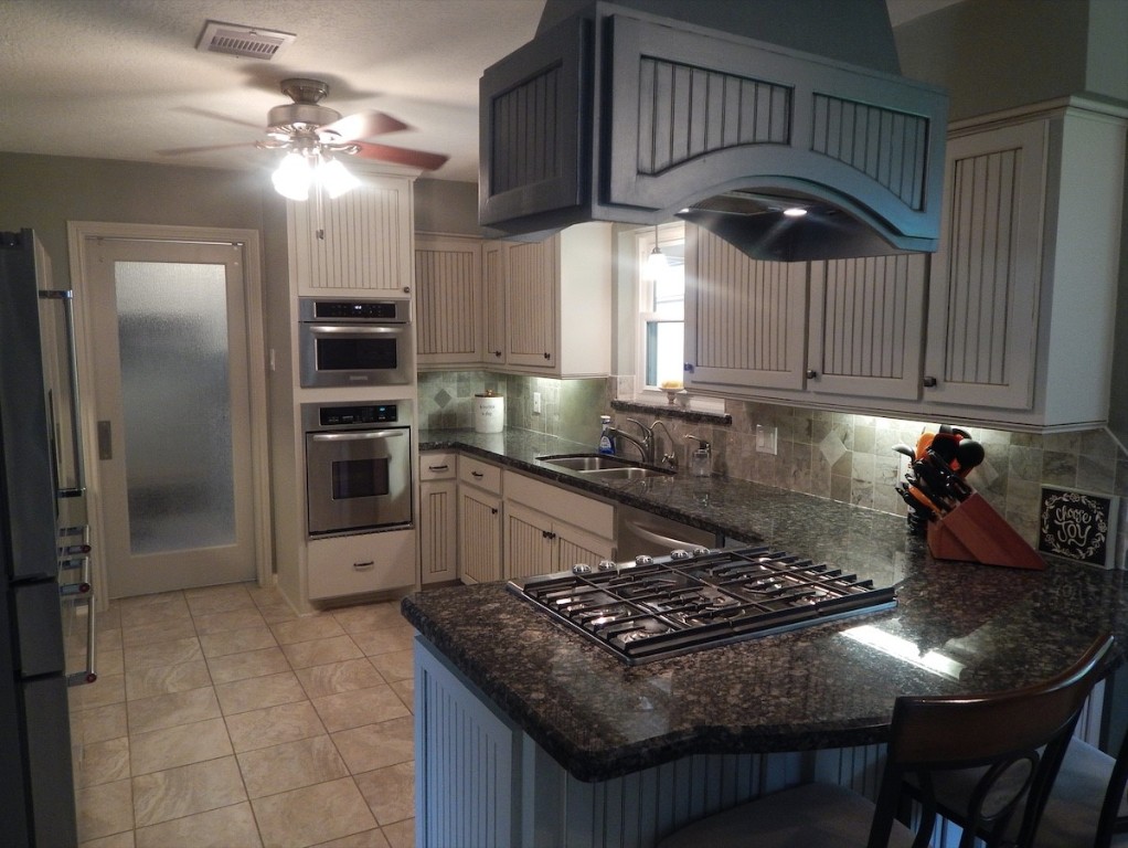 5219 Glenmere Lane Spring, TX 77379 - Photo 7 of 36 a kitchen with stainless steel appliances granite countertop a stove a sink and a refrigerator