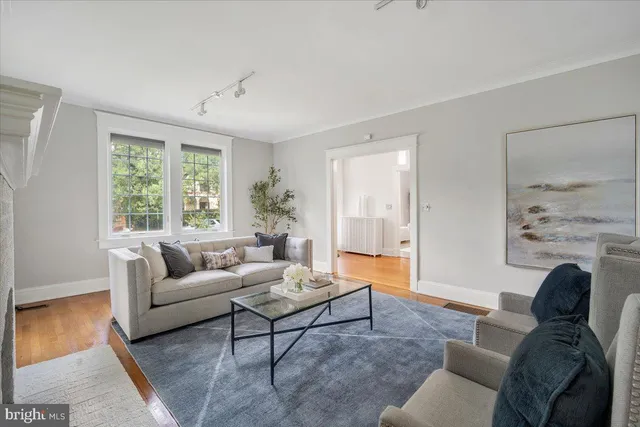 a kitchen with stainless steel appliances granite countertop a sink a stove and cabinets