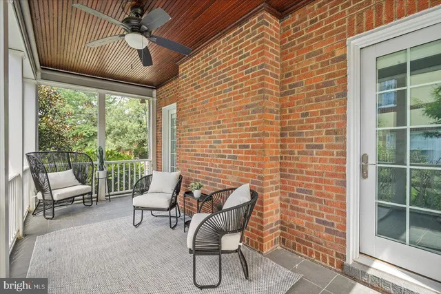 a view of a backyard with sitting area