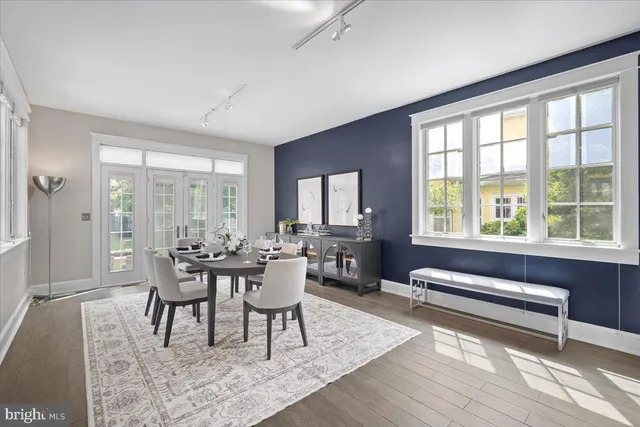 a spacious bedroom with a bed and a large window