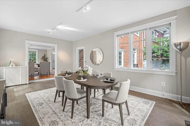 a bedroom with a large bed and a large window