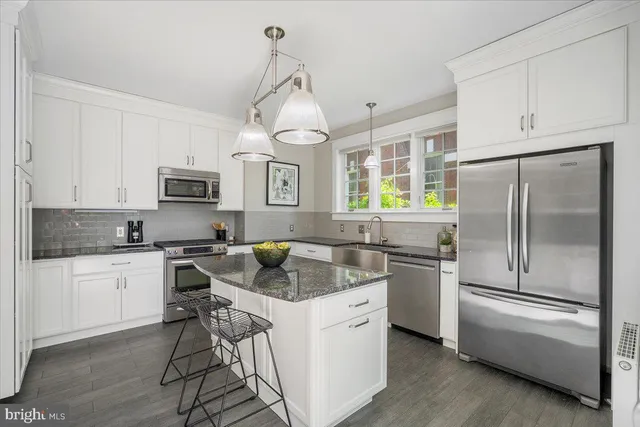 a spacious bedroom with a bed and a couch