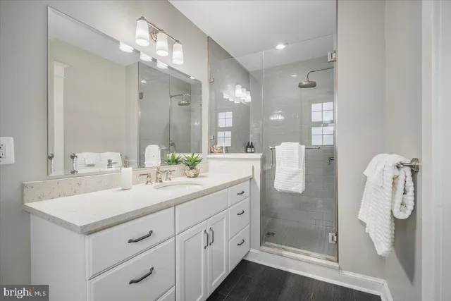 a spacious bedroom with a bed and a couch