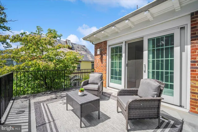 a view of a room with cabinets and wooden floor