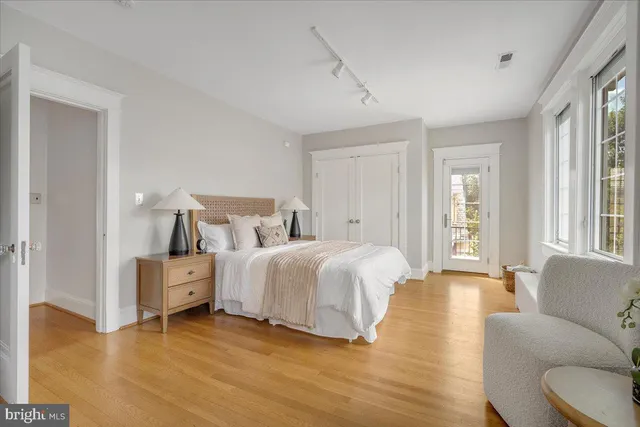 a bathroom with a granite countertop toilet a sink and a bathtub