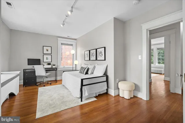 a view of a table and chairs in backyard of the house