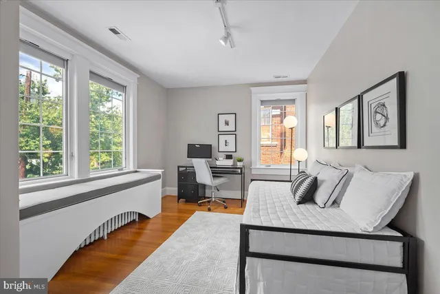 a view of a sitting area with furniture in backyard