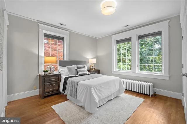 a view of a house with a yard garage and tree