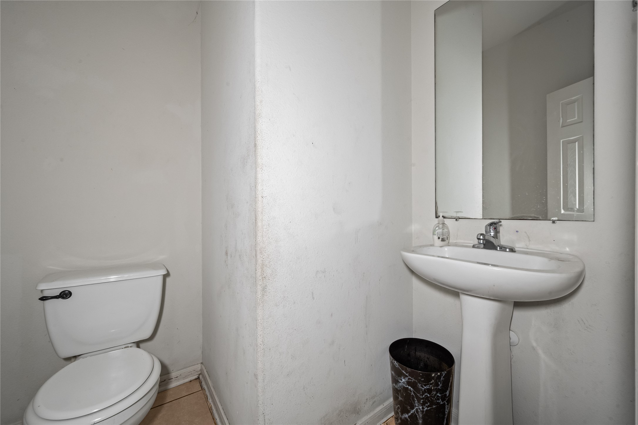 28832 San Bernard River Loop Spring, TX 77386 - Photo 18 of 50 a bathroom with a toilet sink and mirror