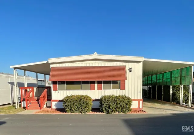 a front view of a house with a outdoor space